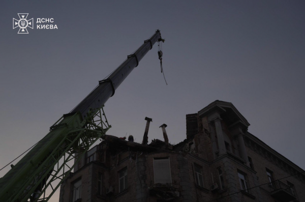 Emergency work continues at the site of yesterday's strike on central Kyiv