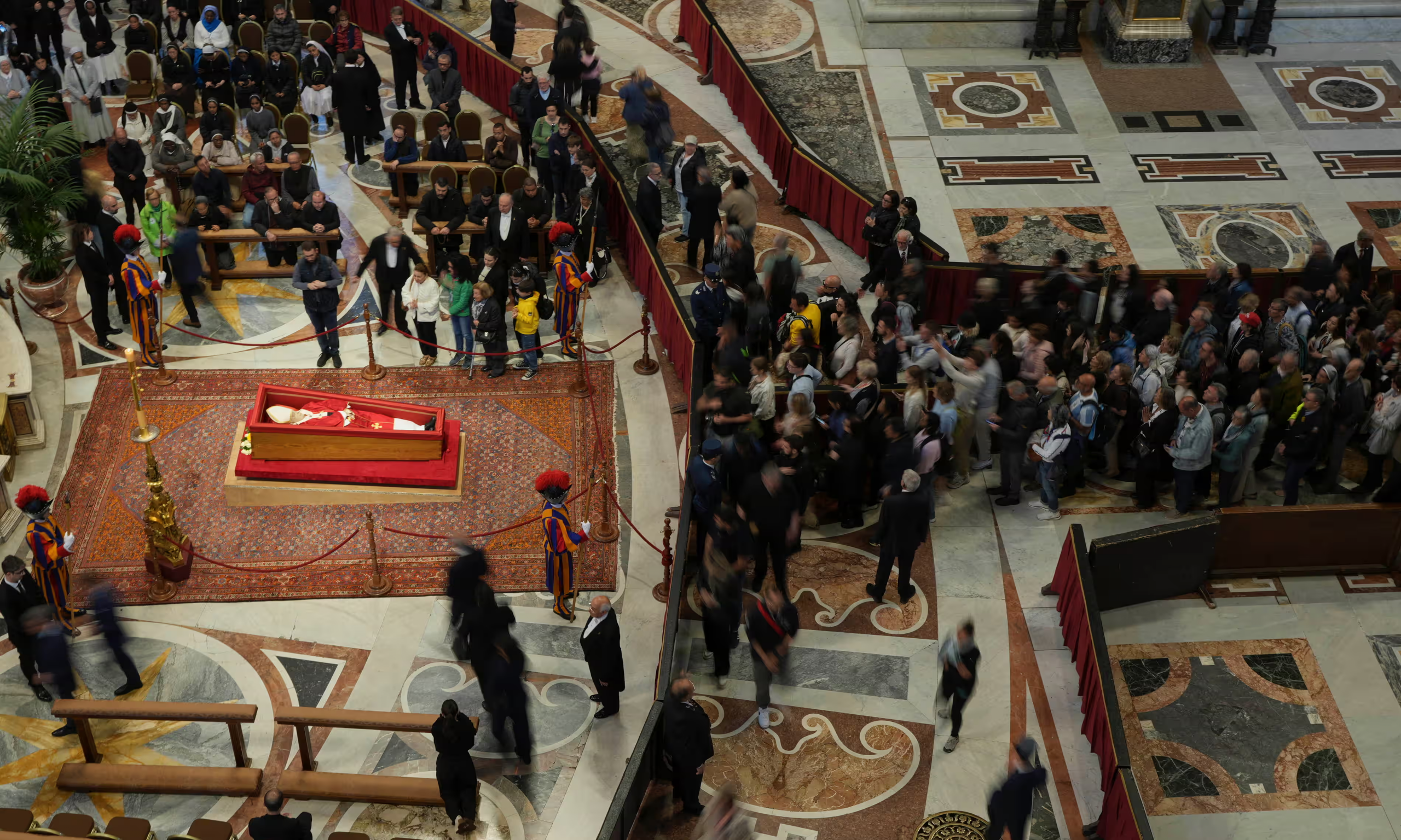 St. Peter’s Basilica remains open overnight for Pope Francis' farewell: Over 60,000 mourners have already paid their respects ahead of his funeral on Saturday.