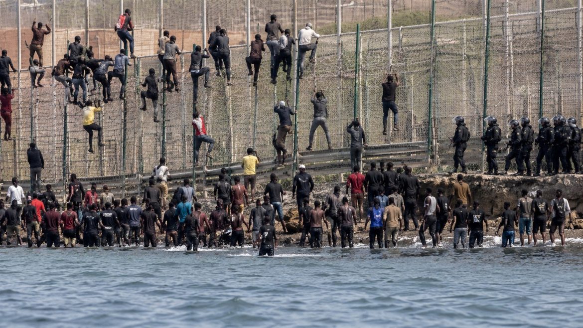 Ceuta migrant surge brings up to 60,000 people across Morocco’s border, prompting Spanish troop deployment and a Schengen dispute.
