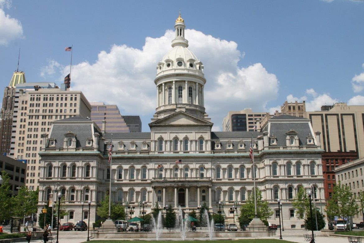 Baltimore City Hall with its dome and fountain on a sunny day