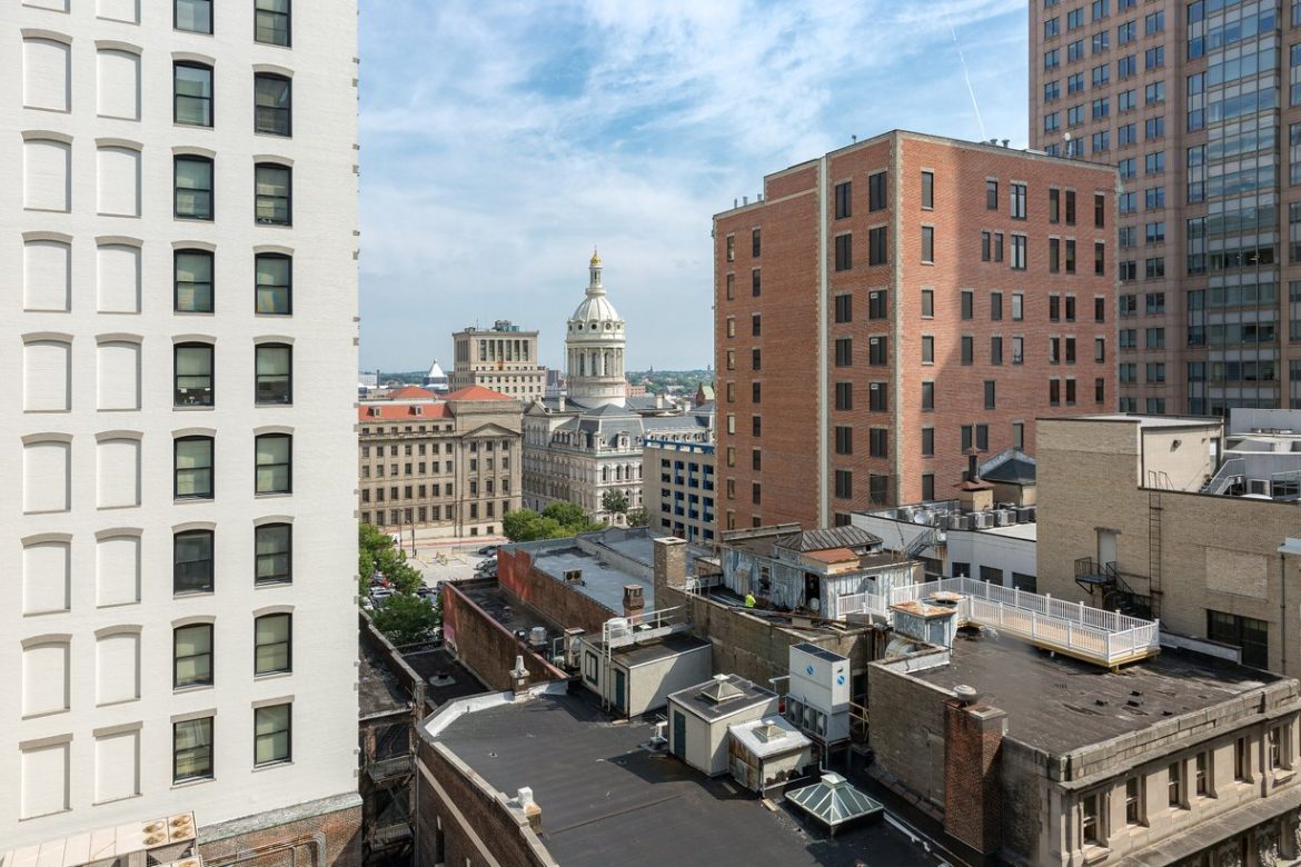 Baltimore City Hall's dome seen above downtown rooftops