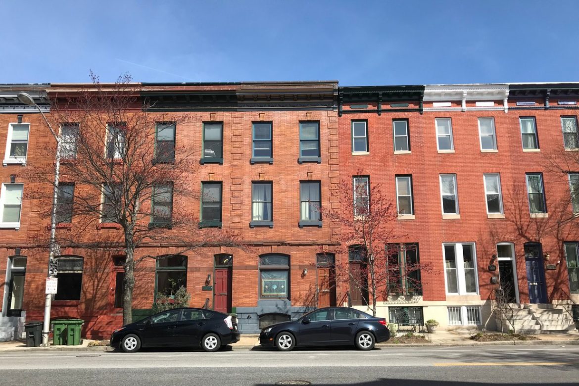Brick rowhouses along East Baltimore Street in Baltimore