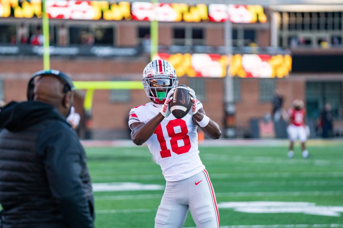 Marvin Harrison Jr. in an Ohio State jersey catching a pass during warmups at Maryland in 2022