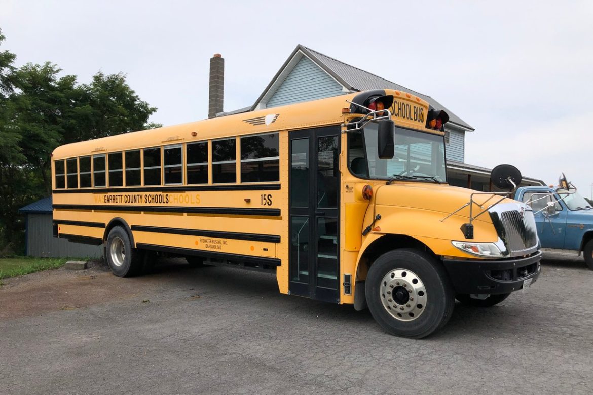 Yellow school bus on a rural Maryland highway