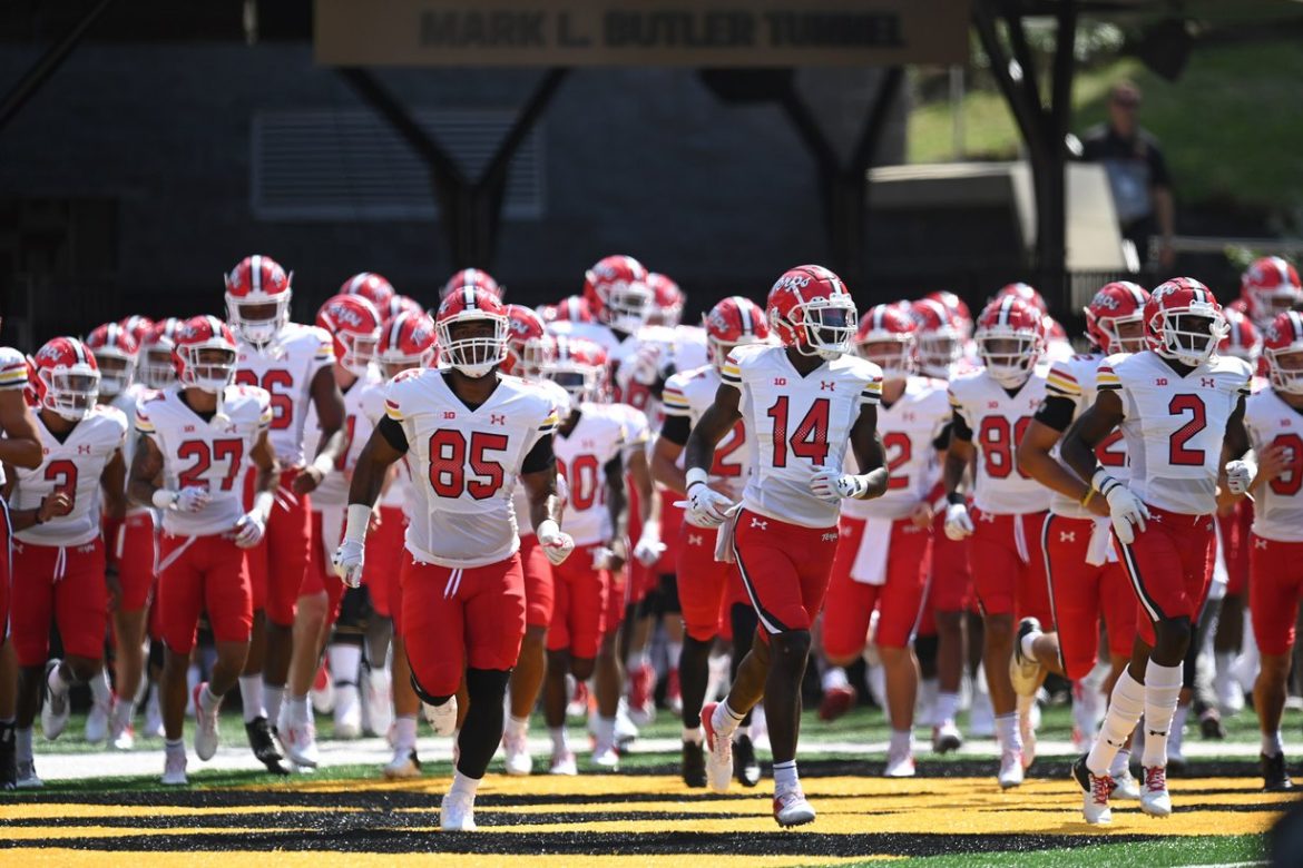 Maryland Terrapins football players run onto the field before a home game in College Park