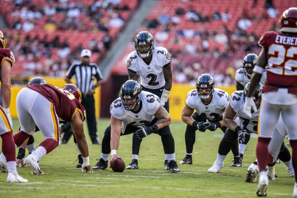 Ravens quarterback Tyler Huntley (2) lines up behind center during a preseason game